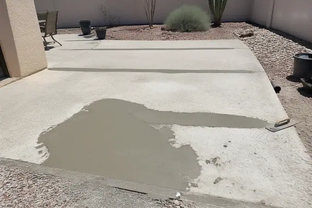 Epoxy coating prep on an outdoor concrete patio in South Tucson, AZ, showing surface leveling and aggregate repairs.