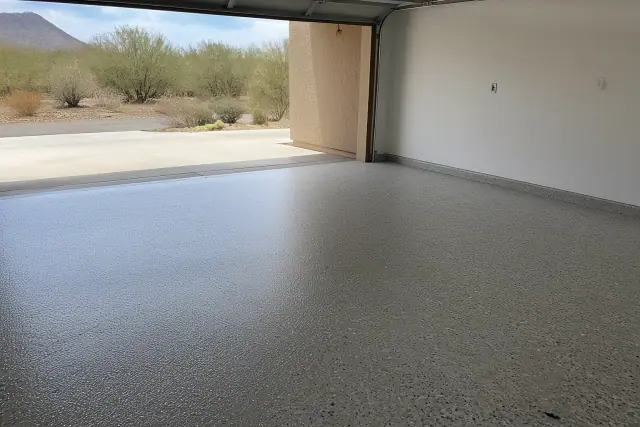 Finished polyaspartic floor coating in a residential garage with desert views in Tucson, AZ.