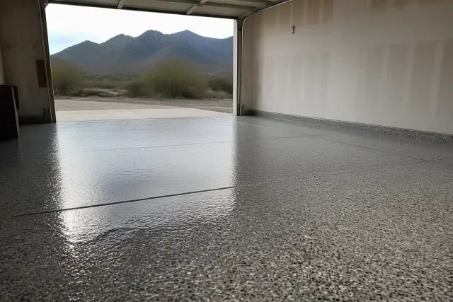 Freshly applied polyaspartic floor coating with vinyl flakes on a residential garage floor in Vail, AZ.