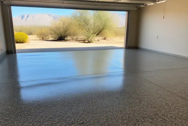 Freshly applied polyaspartic floor coating with flake texture in a residential garage in Oro Valley, AZ.