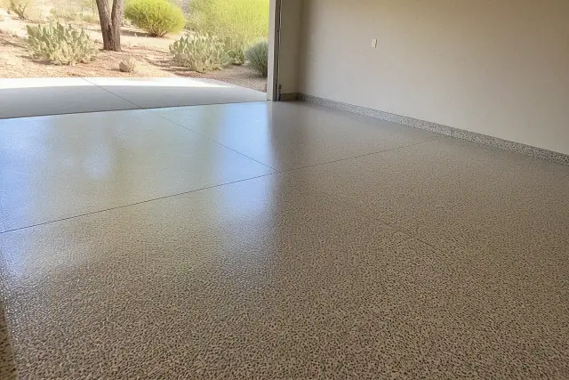 Freshly installed speckled polyaspartic floor coating in a residential garage in Green Valley, AZ.