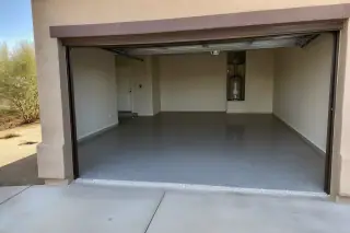 Finished flake epoxy floor in a residential garage with a view of Sonoran desert landscaping in Tucson, AZ.