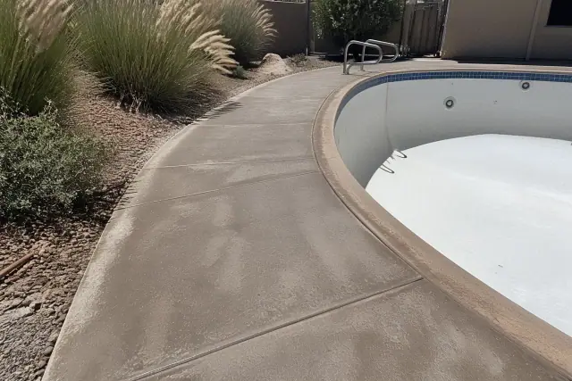 Concrete pool deck ready for a slip-resistant sealant at an outdoor pool in Sahuarita, AZ.