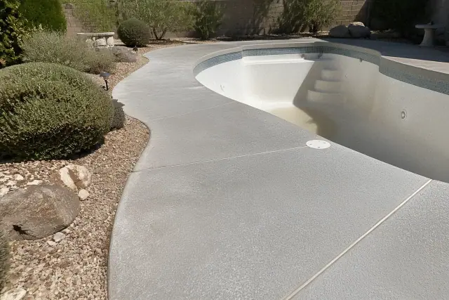 Prepped concrete pool deck surface waiting for a protective sealant in Green Valley, AZ.
