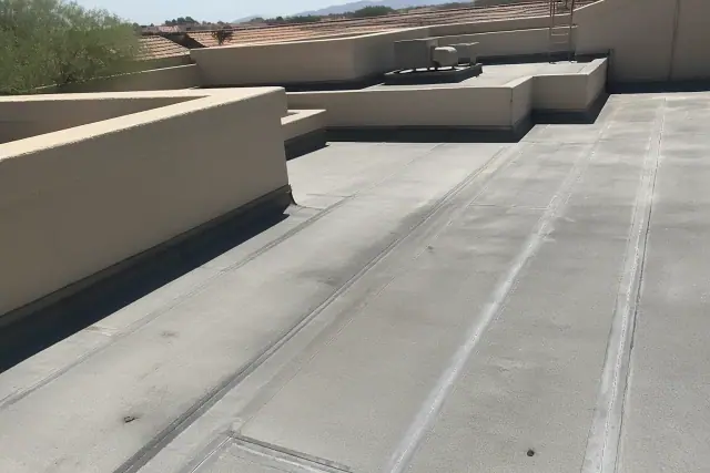 Heat-welded repair seams on a commercial flat roof membrane in the bright desert sunlight of Tucson, AZ.