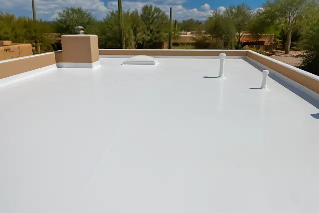 White reflective roof coating applied to a flat residential roof in Casas Adobes, AZ.