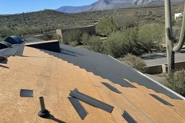 Asphalt shingles being installed on a sloped roof in Oro Valley, AZ.