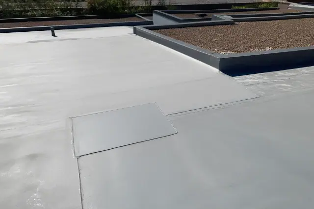 Heat-welded flat roof seam repair on a commercial building rooftop in Tucson, AZ.