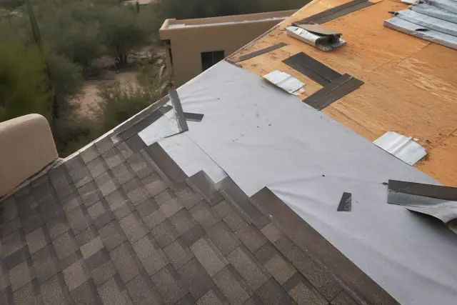 Asphalt shingle roof replacement showing underlayment and decking at a worksite in Tucson, AZ.