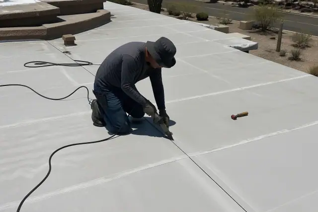 Professional applying heat-welded seams to a TPO and EPDM commercial roof in Tucson, AZ.
