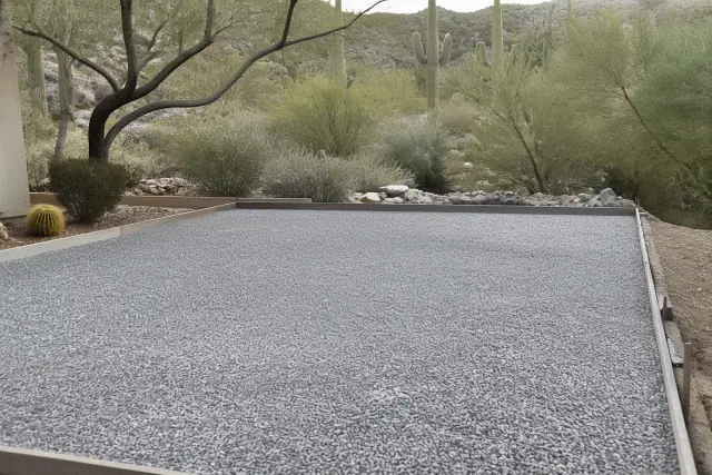 Gravel base prepared for a concrete driveway installation in Catalina Foothills, AZ.