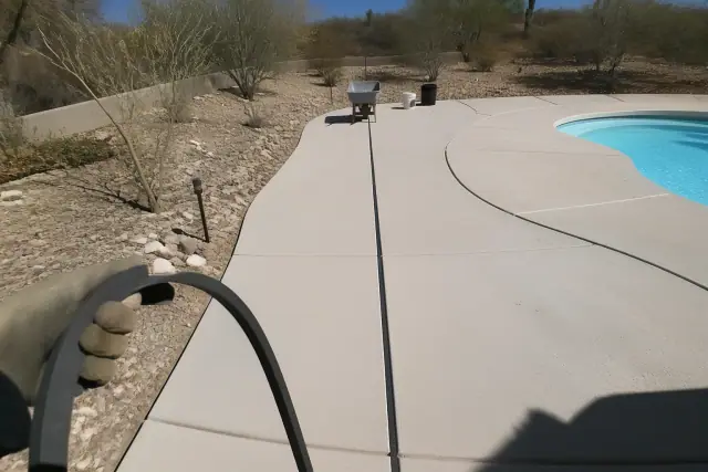 Flexible expansion joint material installed between concrete pool deck segments in Flowing Wells, AZ.