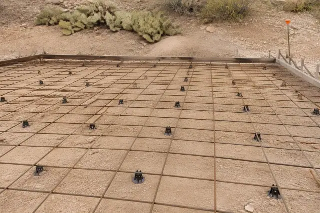 Steel wire grid and plastic spacers on a concrete slab foundation at a jobsite in Oro Valley, AZ.