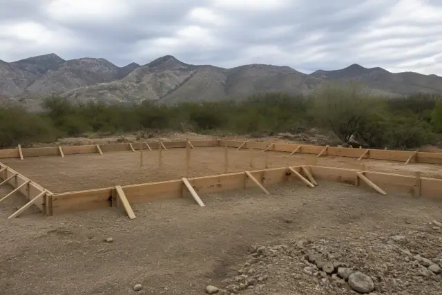 Wooden perimeter formwork for a concrete slab foundation at a construction site in Green Valley, AZ.
