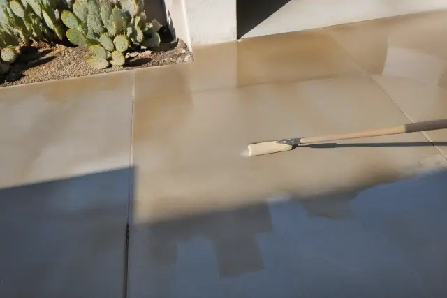 Epoxy coating being applied to a residential concrete surface in Tucson, AZ.