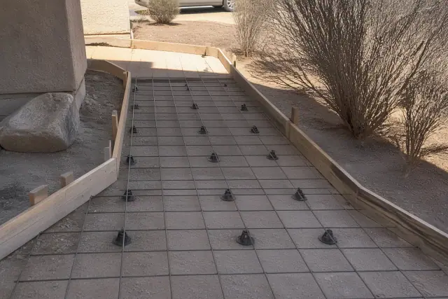 Freshly poured heavy-traffic concrete sidewalk at a residential jobsite in Tucson, AZ with desert surroundings.