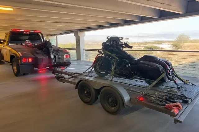 Motorcycle secured on a trailer in a concrete parking structure in Sahuarita, AZ.